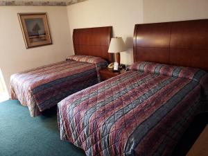 Postel nebo postele na pokoji v ubytování Huntingdon Motor Inn
