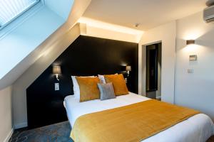 Postel nebo postele na pokoji v ubytování Europe Haguenau – Hotel & Spa