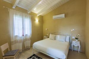 Ένα ή περισσότερα κρεβάτια σε δωμάτιο στο Agriturismo Villa Beatrice