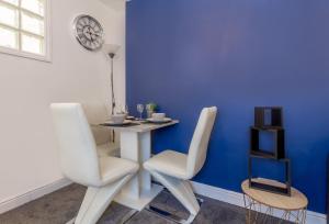 a dining room with a table and two chairs at Host & Stay - New Street Suite in Worcester +2 photos