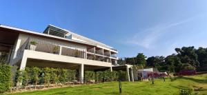 a white building with a bunch of vines at Aranya Resort Koh Lanta in Ko Lanta