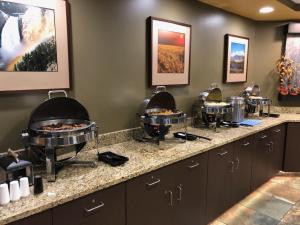 a row of food stations in a room at C'mon Inn Billings in Billings