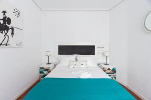 Ένα ή περισσότερα κρεβάτια σε δωμάτιο στο Homelike Embajadores