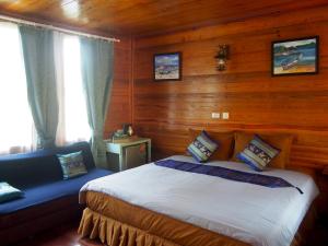 Postel nebo postele na pokoji v ubytování Coco Beach Bungalows
