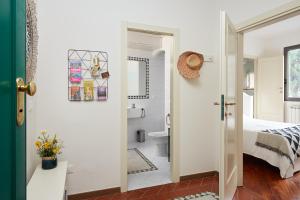 a bathroom with a bed and a toilet in a room at Casa Cosi - Maria Novella in Florence +15 photos