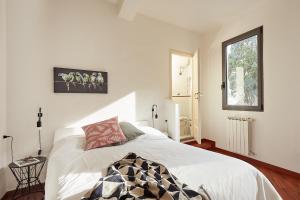 a bedroom with a white bed and a window at Casa Cosi - Maria Novella in Florence