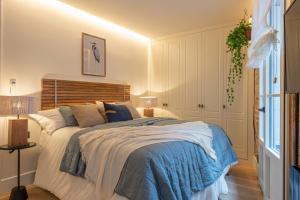 Łóżko lub łóżka w pokoju w obiekcie Arechaga AC by Staynnapartments