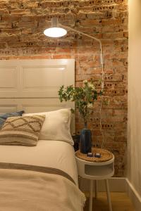 Łóżko lub łóżka w pokoju w obiekcie Arechaga AC by Staynnapartments