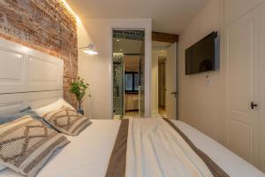 Łóżko lub łóżka w pokoju w obiekcie Arechaga AC by Staynnapartments