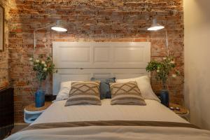Łóżko lub łóżka w pokoju w obiekcie Arechaga AC by Staynnapartments