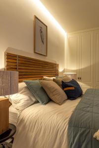 Łóżko lub łóżka w pokoju w obiekcie Arechaga AC by Staynnapartments