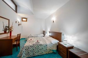 Postel nebo postele na pokoji v ubytování La Cascina - Villa Nenno