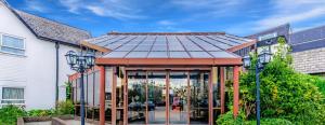 a building with a solar roof on top of it at Britannia Hotel Wigan in Standish