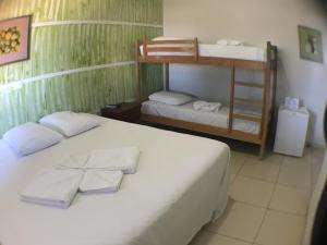 Postel nebo postele na pokoji v ubytování Hotel Pousada Calliandra
