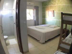 Postel nebo postele na pokoji v ubytování Hotel Pousada Calliandra