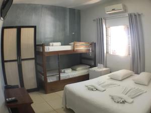Postel nebo postele na pokoji v ubytování Hotel Pousada Calliandra