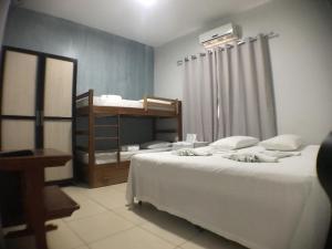 Postel nebo postele na pokoji v ubytování Hotel Pousada Calliandra