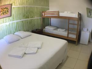 Postel nebo postele na pokoji v ubytování Hotel Pousada Calliandra
