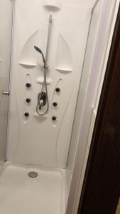 a bathroom with a sink with a pair of scissors at Monteurwohnung in Zerbst