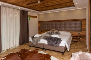 Postel nebo postele na pokoji v ubytování Hotel K2