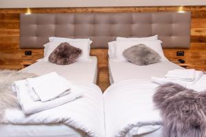 Postel nebo postele na pokoji v ubytování Hotel K2