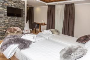 Postel nebo postele na pokoji v ubytování Hotel K2