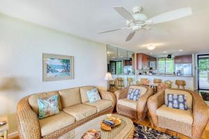 a living room with a couch and two chairs at Country Club Villas in Kailua-Kona