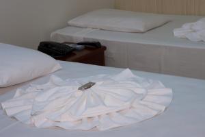 Postel nebo postele na pokoji v ubytování Hotel Pousada Calliandra