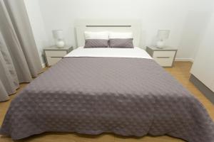 Casa do Mar tesisinde bir odada yatak veya yataklar