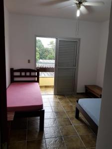 Ένα ή περισσότερα κρεβάτια σε δωμάτιο στο Condomínio Guaraciaba