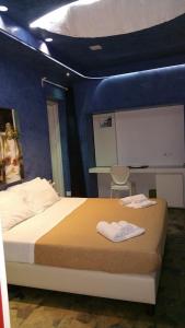 Postel nebo postele na pokoji v ubytování San Giorgio Modica Hotel