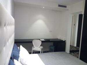 Postel nebo postele na pokoji v ubytování San Giorgio Modica Hotel