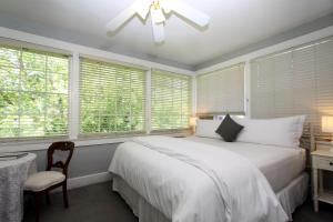 a bedroom with a large bed and a large window at The Napa Inn in Napa