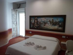 Postel nebo postele na pokoji v ubytování San Giorgio Modica Hotel