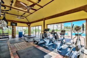 a gym with several treadmills and elliptical machines at Altitude Adjustment in Santa Rosa Beach