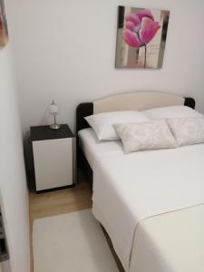 Postel nebo postele na pokoji v ubytování Apartments Vujić