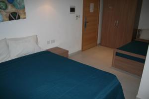 Llit o llits en una habitació de Harbour Lodge