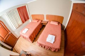 Postel nebo postele na pokoji v ubytování Hotel Arunta