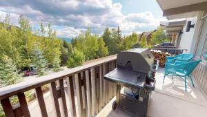 a grill on the balcony of a house at Lichenhearth - CoralTree Residence Collection in Snowmass Village