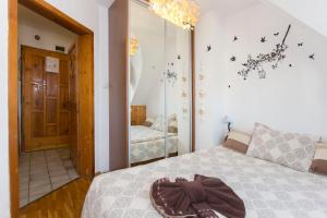 a bedroom with a bed with a brown purse on it at Bella Vista - Cosy 1BD Flat with a Big Terrace in Sofia