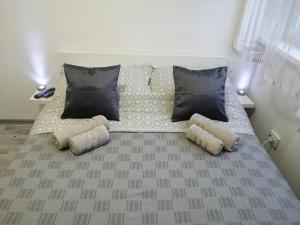 a bed with pillows on it in a room at Ruby room in Zagreb