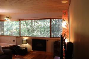 
A television and/or entertainment center at Linden Gardens Rainforest Retreat
