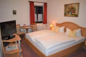 En eller flere senge i et værelse på Hotel Pension Lindenhof