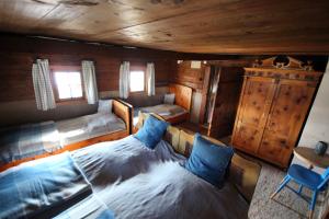 Ein Bett oder Betten in einem Zimmer der Unterkunft Goass'n Alm Zillertal