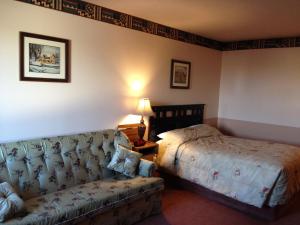 Postel nebo postele na pokoji v ubytování Traveller's Inn