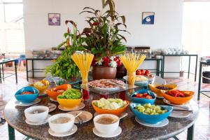 a table with many bowls of food on it at Royal Lanta Resort & Spa in Ko Lanta