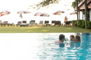a group of people in a swimming pool at Royal Lanta Resort & Spa in Ko Lanta