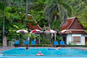 a group of people in the swimming pool at a resort at Royal Lanta Resort & Spa in Ko Lanta