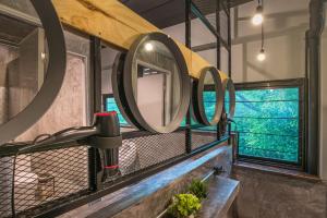 a bathroom with a mirror and a sink at Sanim Hostel in Ao Nang Beach