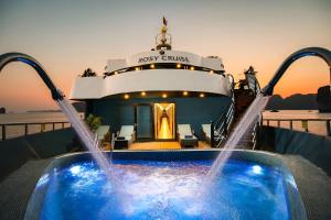 a pool on a cruise ship with water fountains at Rosy Cruises in Ha Long